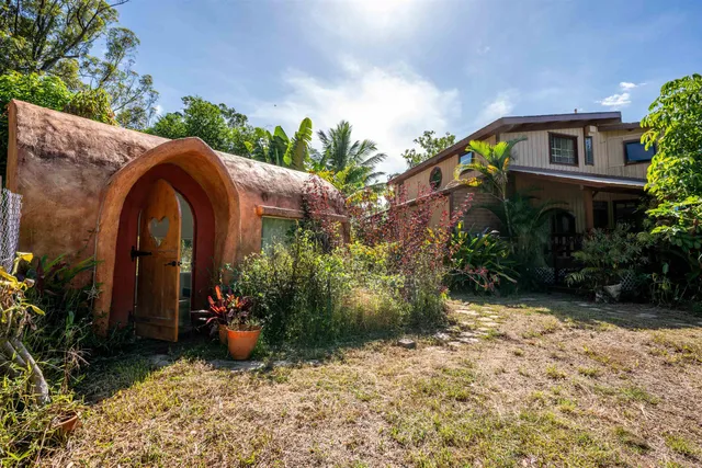 a large kitchen with stainless steel appliances granite countertop a stove and a large refrigerator