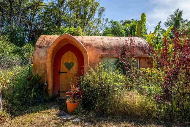 a kitchen with stainless steel appliances granite countertop wooden floors and white cabinets
