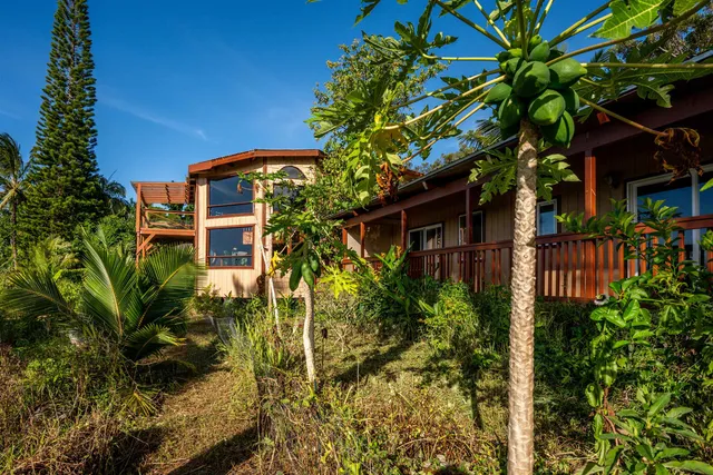 a bathroom with a sink a toilet and shower curtain