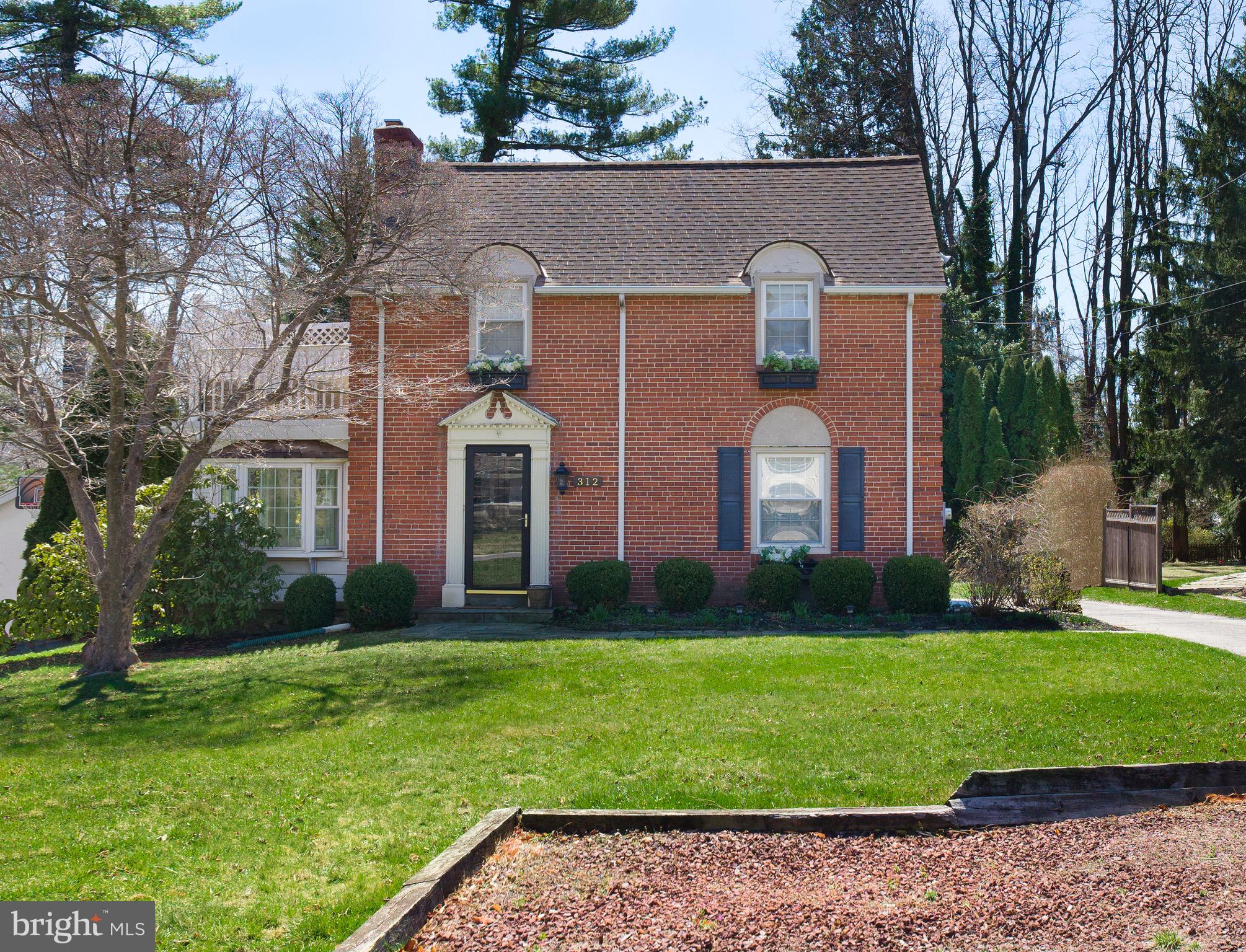 312 Old Lancaster Road Devon, PA 19333 - Photo 1 of 25 a front view of a house with garden