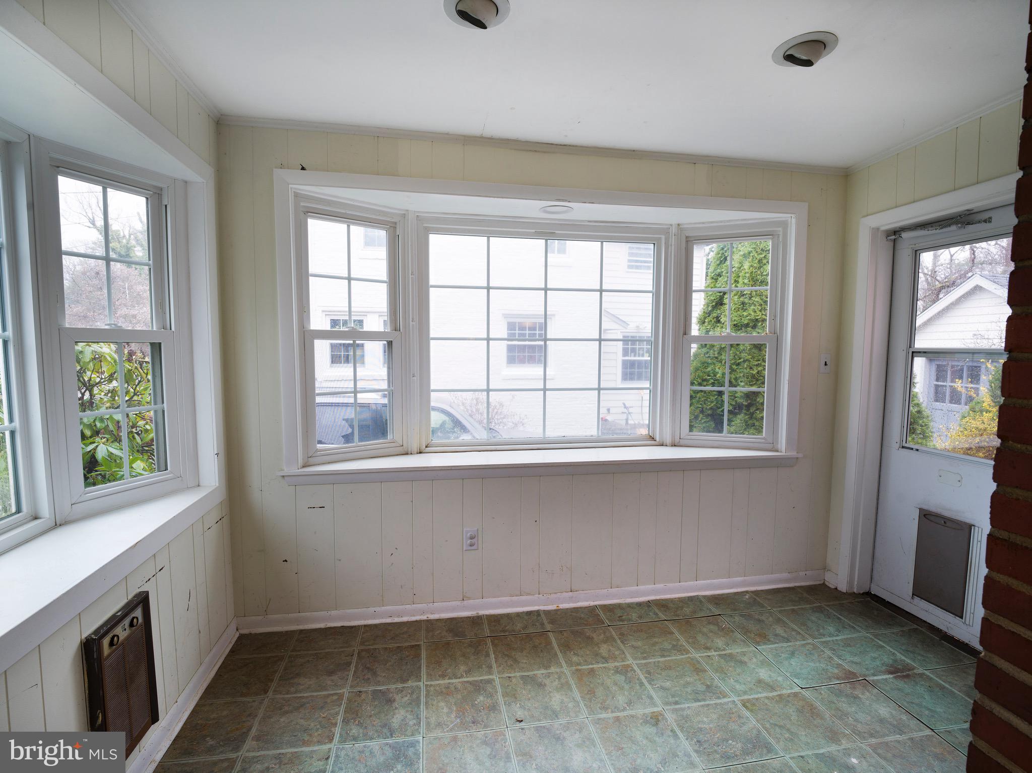 312 Old Lancaster Road Devon, PA 19333 - Photo 15 of 25 a view of an empty room with a fireplace and a window