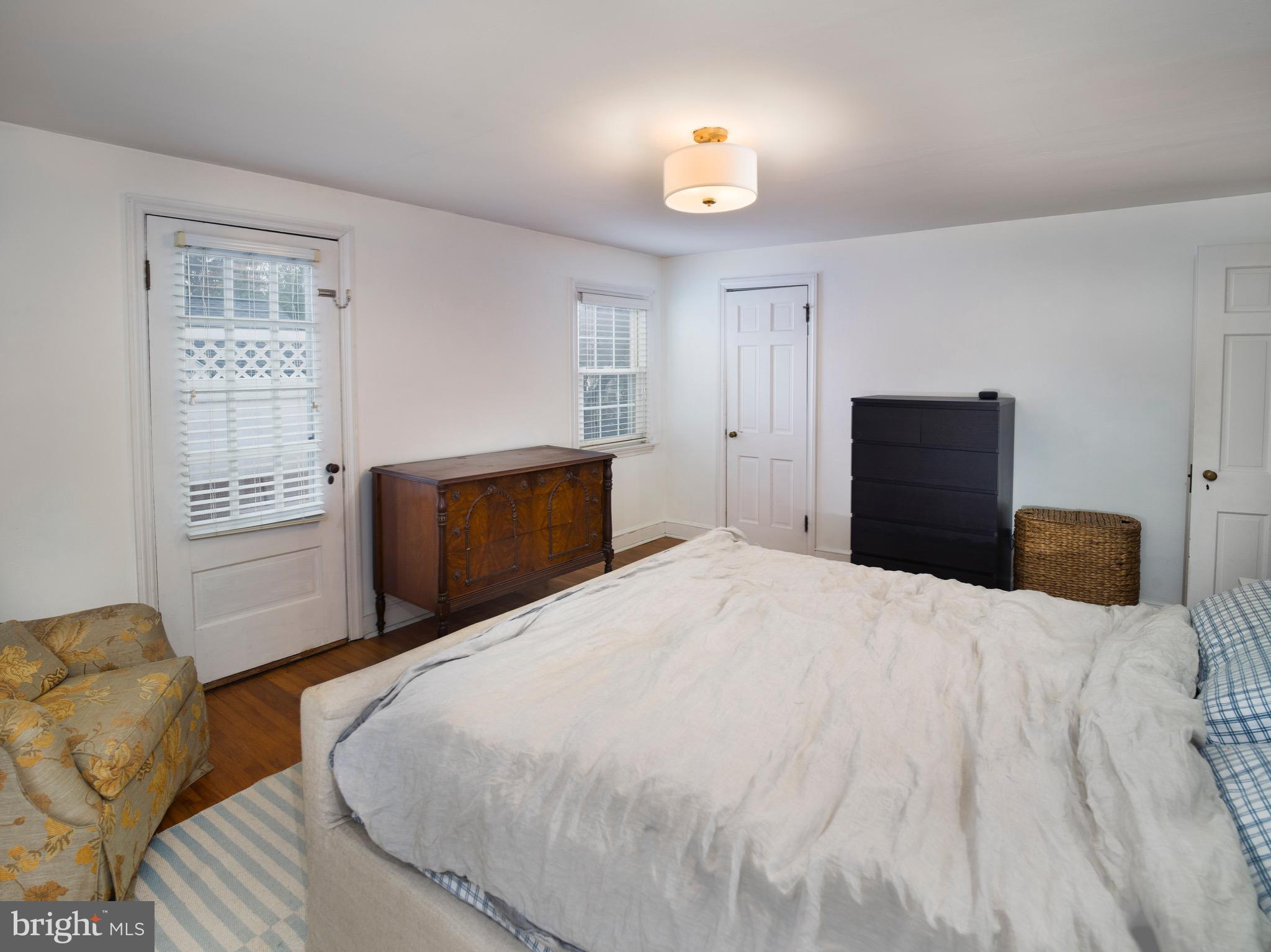 312 Old Lancaster Road Devon, PA 19333 - Photo 17 of 25 a bedroom with a bed and a window