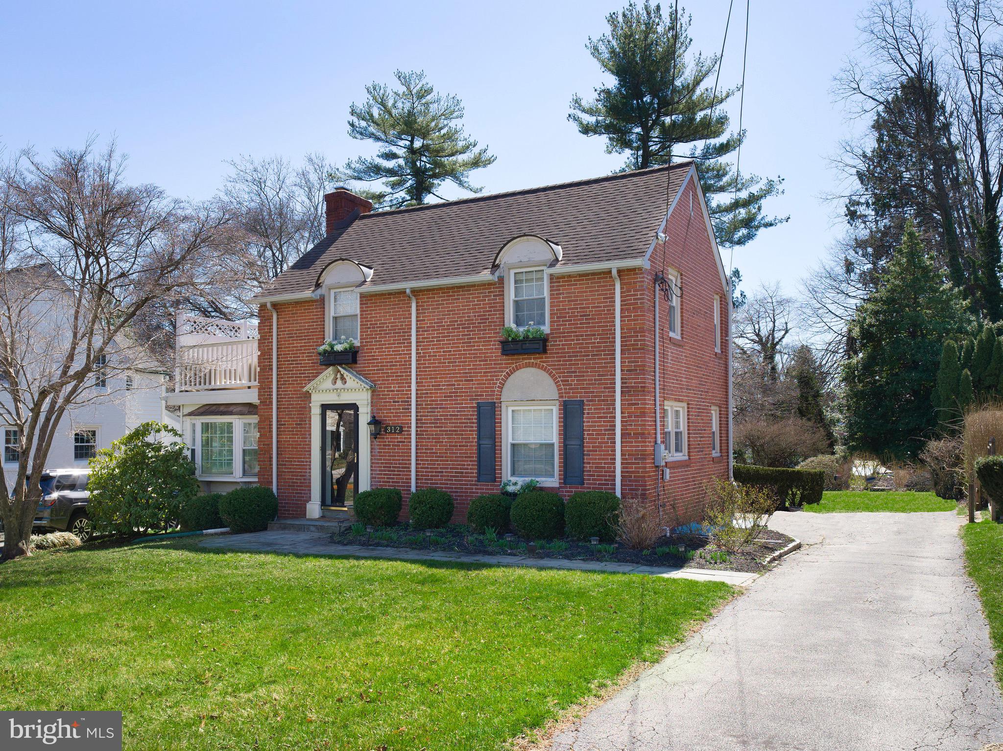 312 Old Lancaster Road Devon, PA 19333 - Photo 2 of 25 a front view of house with yard and green space