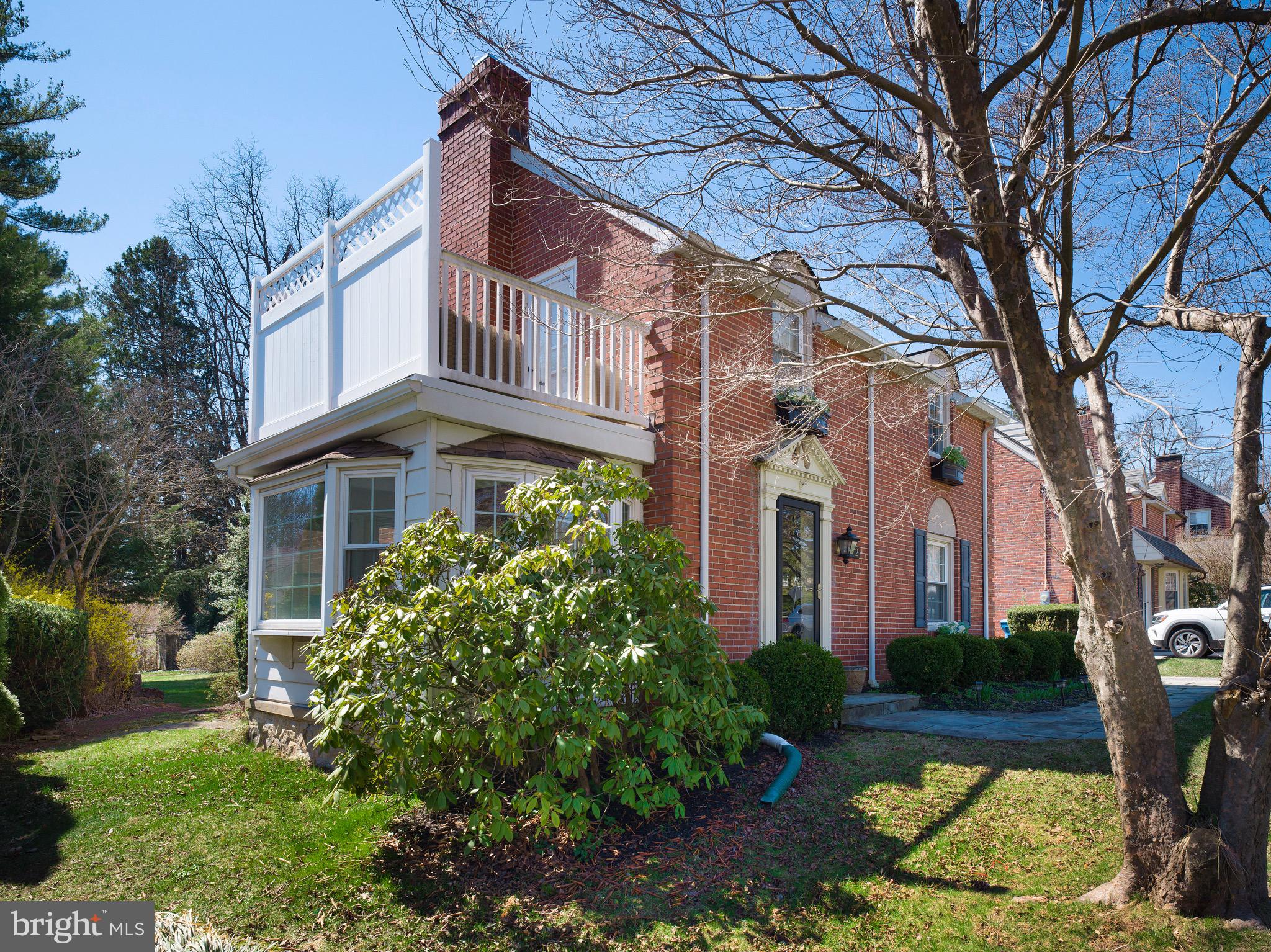 312 Old Lancaster Road Devon, PA 19333 - Photo 4 of 25 a front view of a house with a garden