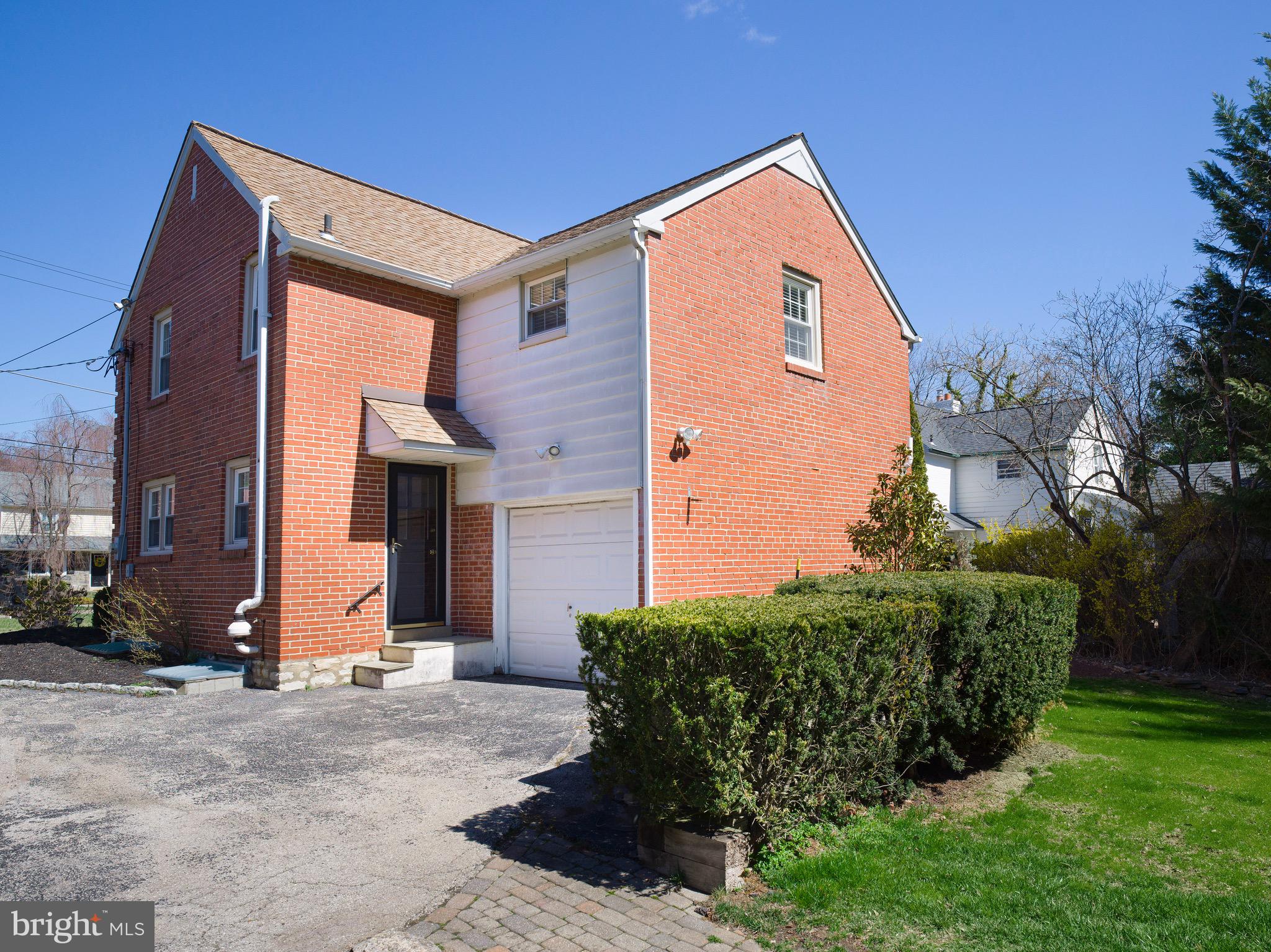 312 Old Lancaster Road Devon, PA 19333 - Photo 5 of 25 a front view of a house with garden