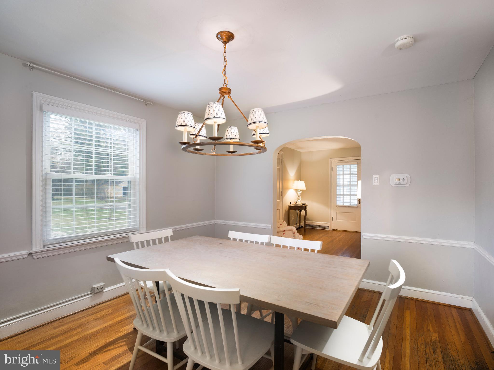 312 Old Lancaster Road Devon, PA 19333 - Photo 10 of 25 a view of a dining room with furniture window and wooden floor