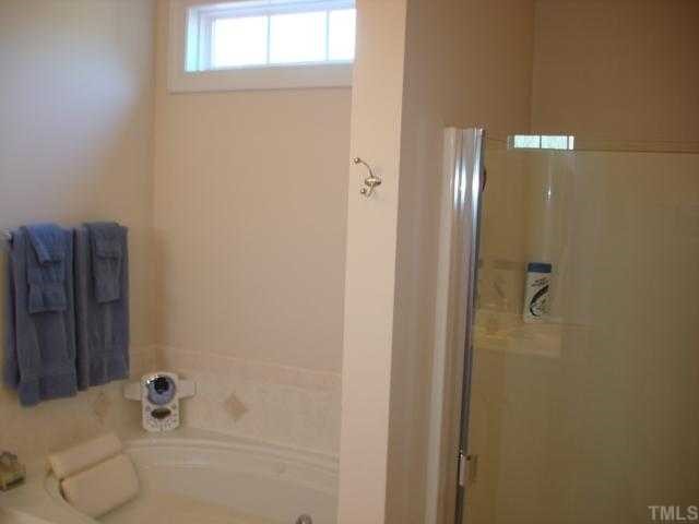 1221 Red Brick Road Garner, NC 27529 - Photo 10 of 11 a bathroom with a bathtub