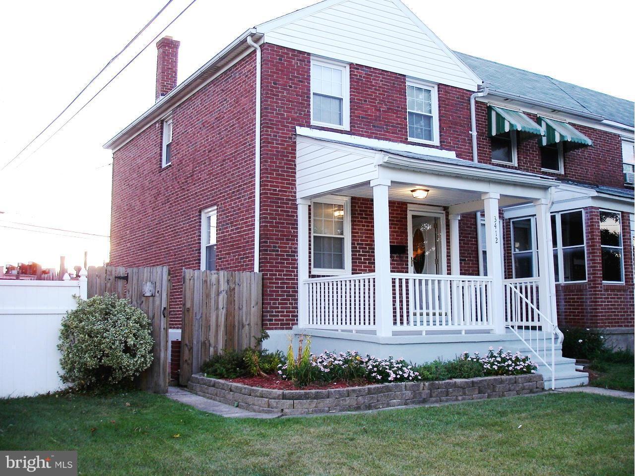 3412 Dunran Road Dundalk, MD 21222 - Photo 1 of 25 a front view of a house with a garden