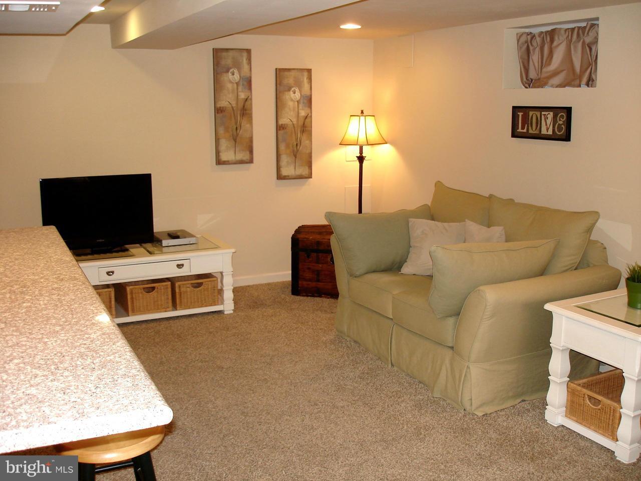 3412 Dunran Road Dundalk, MD 21222 - Photo 15 of 25 a living room with furniture and a flat screen tv