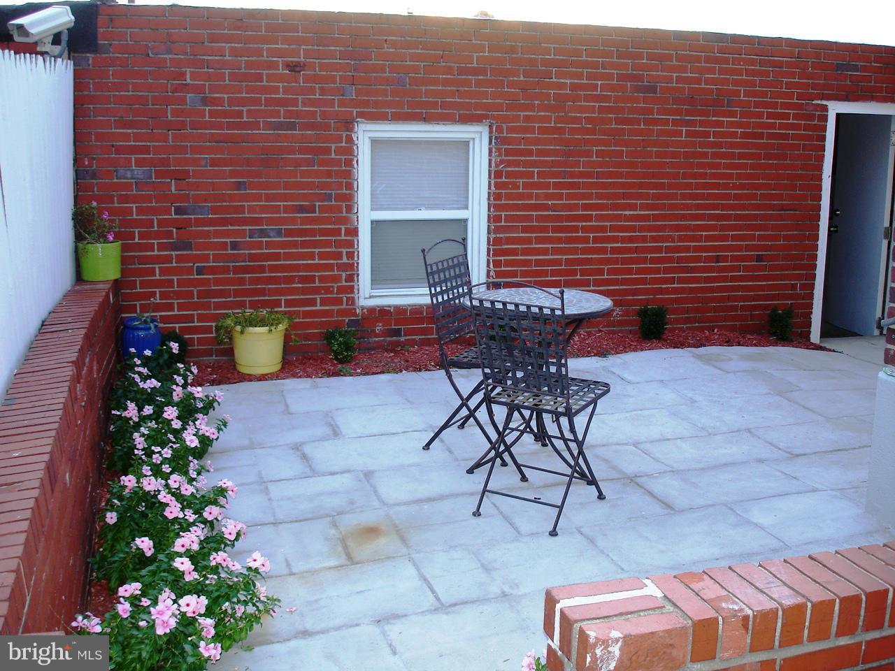 3412 Dunran Road Dundalk, MD 21222 - Photo 21 of 25 a brick building with a bench in front of it