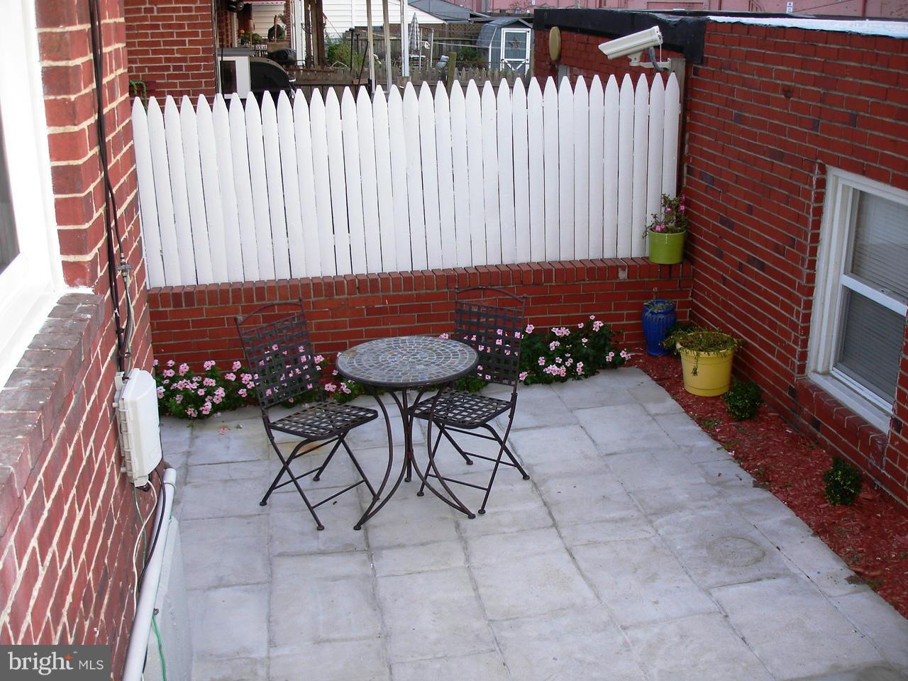 3412 Dunran Road Dundalk, MD 21222 - Photo 23 of 25 a backyard of a house with table and chairs