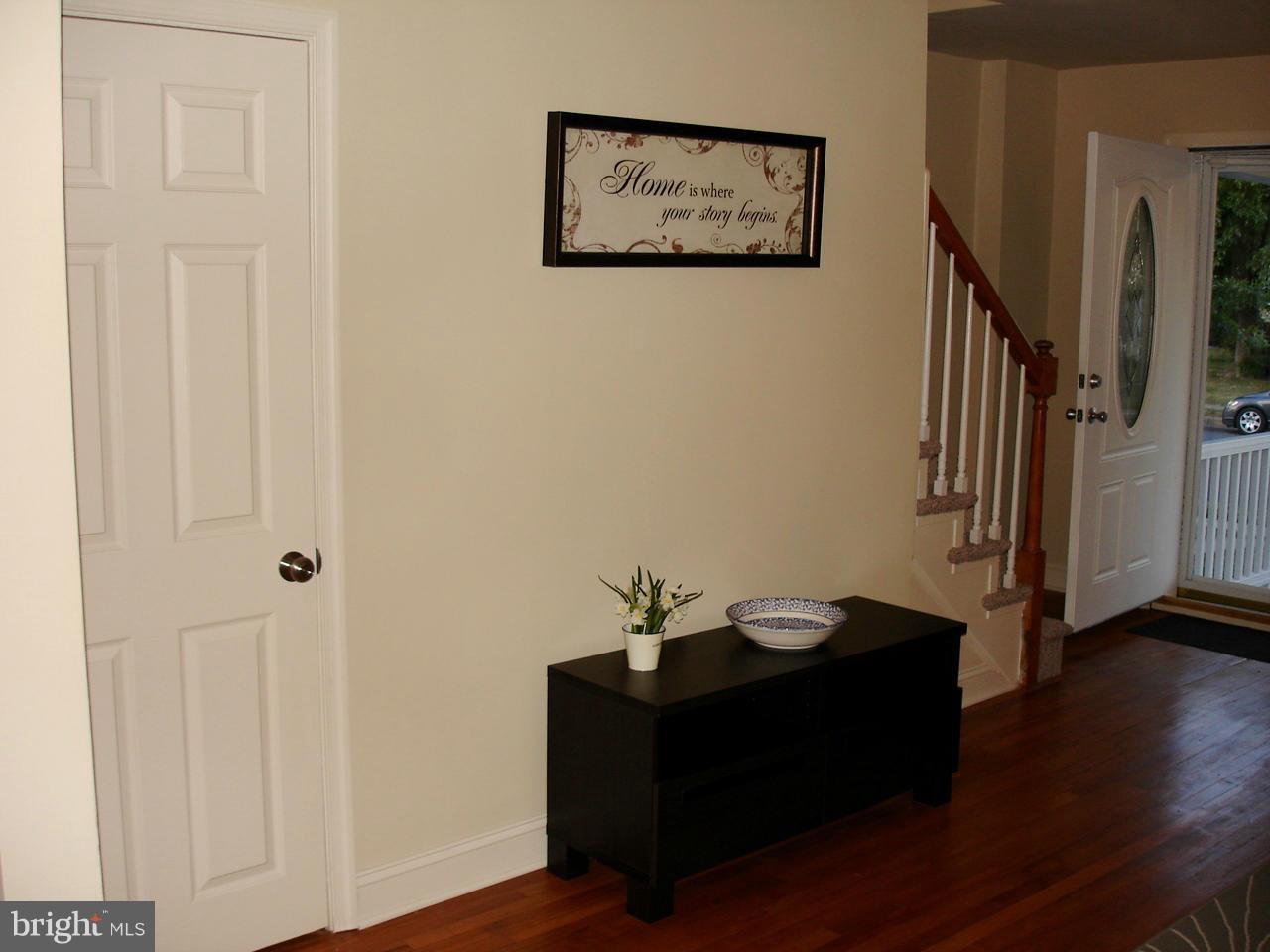3412 Dunran Road Dundalk, MD 21222 - Photo 24 of 25 a room with painting on the wall and a wooden floor