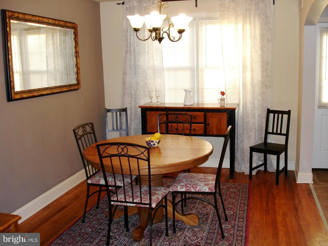 3412 Dunran Road Dundalk, MD 21222 - Photo 4 of 25 a view of a dining room with furniture and wooden floor