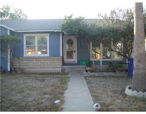 a view of house with backyard