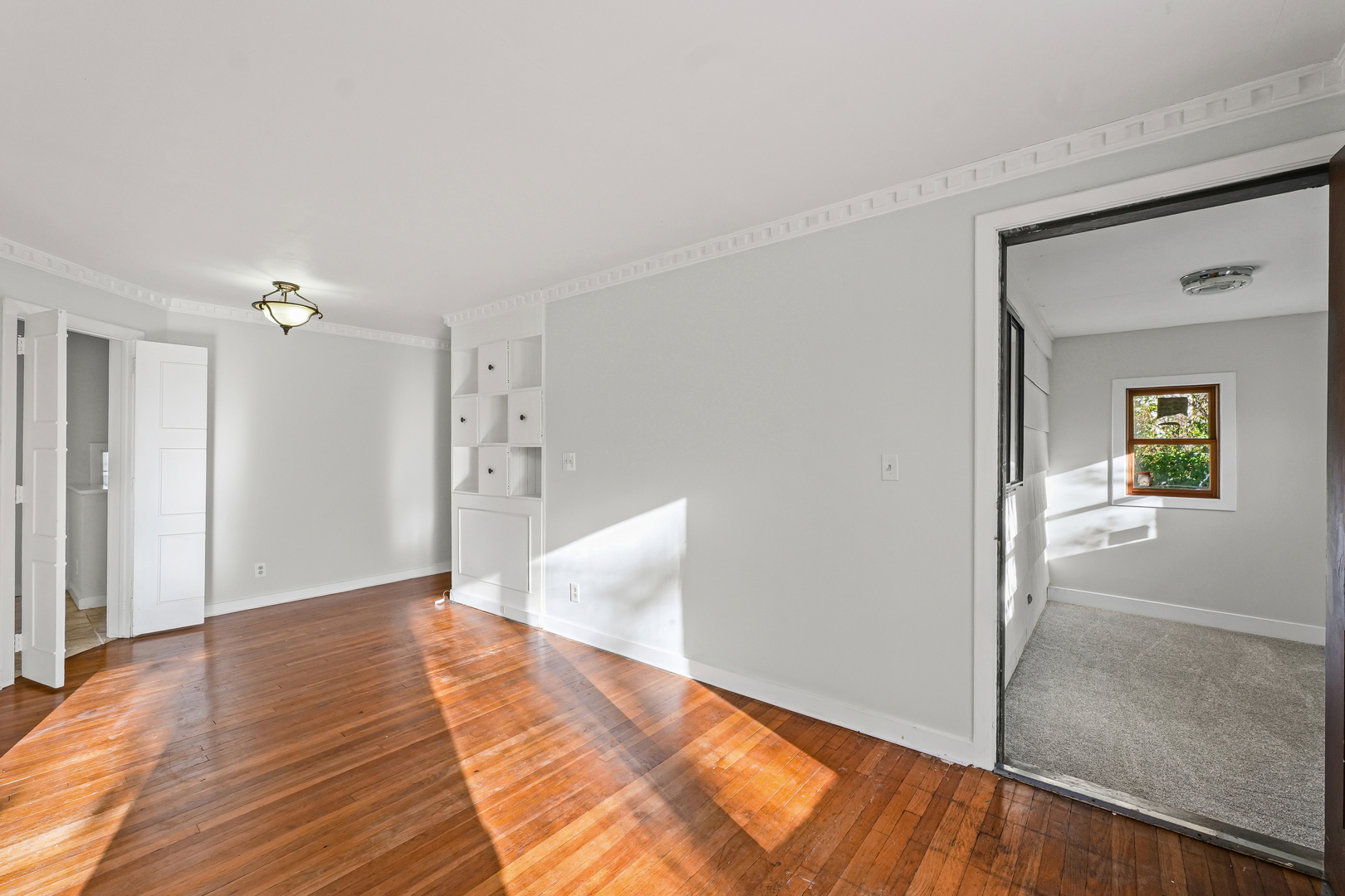302 Flora Drive Champaign, IL 61821 - Photo 14 of 34 a view of a room with wooden floor and cabinet