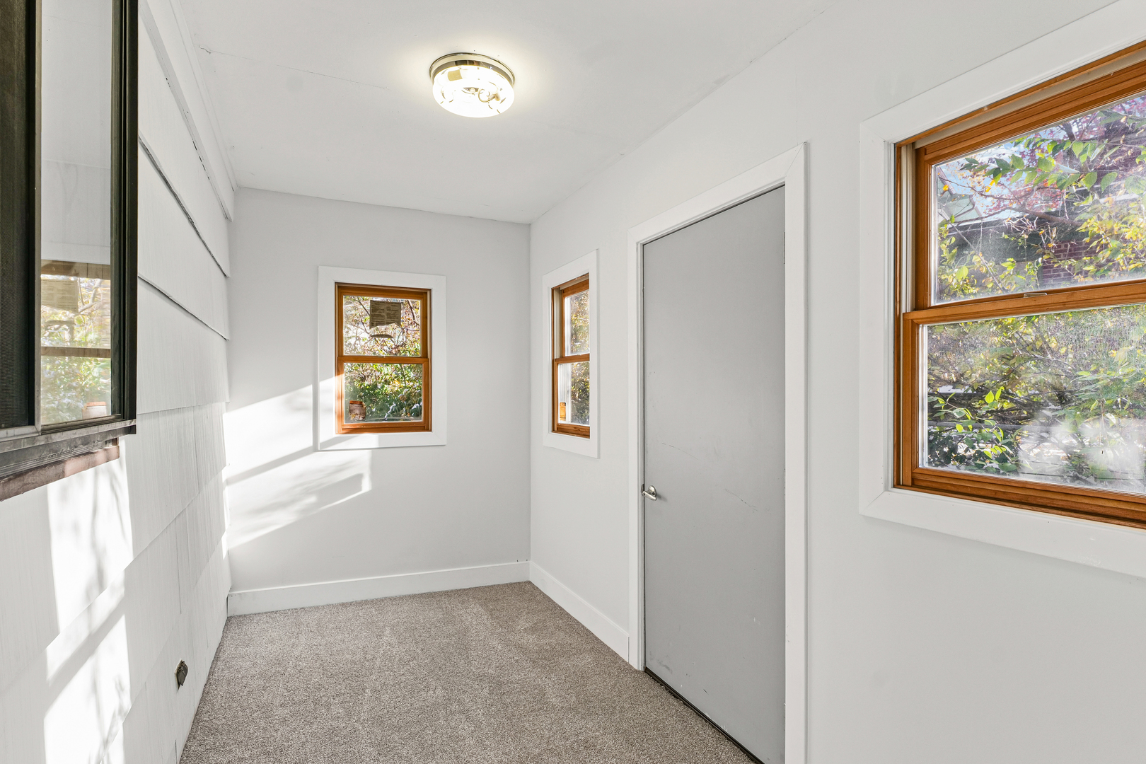 302 Flora Drive Champaign, IL 61821 - Photo 15 of 34 an empty room with windows