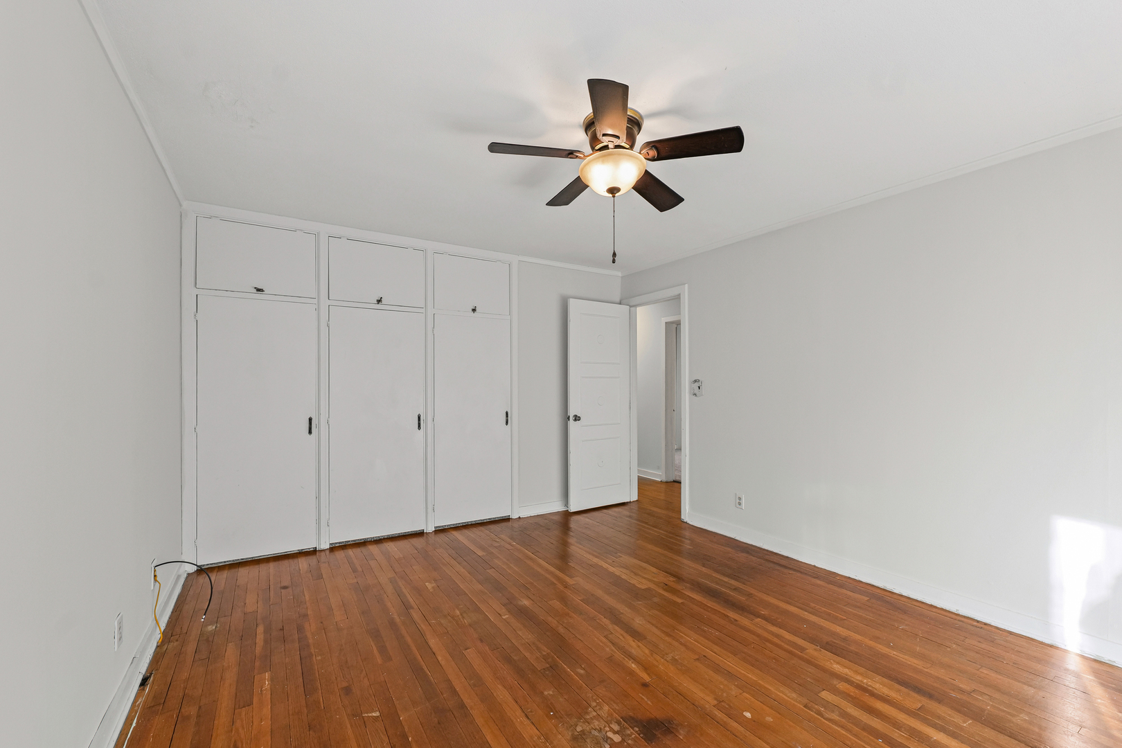 302 Flora Drive Champaign, IL 61821 - Photo 22 of 34 a view of room with wooden floor and ceiling fan
