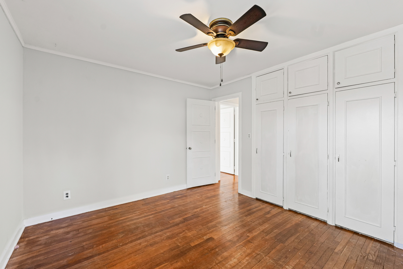 302 Flora Drive Champaign, IL 61821 - Photo 24 of 34 a view of an empty room with wooden floor