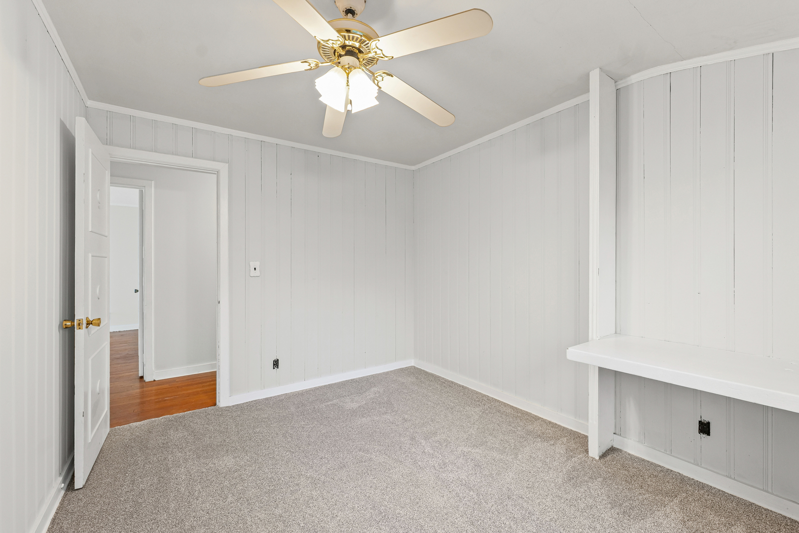 302 Flora Drive Champaign, IL 61821 - Photo 28 of 34 an empty room with a ceiling fan and a window