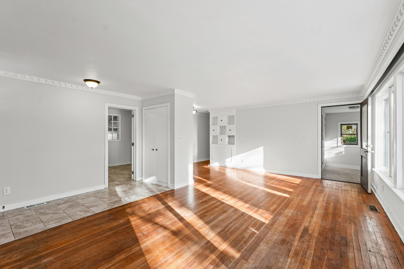 302 Flora Drive Champaign, IL 61821 - Photo 7 of 34 a bedroom with a bed and wooden floor