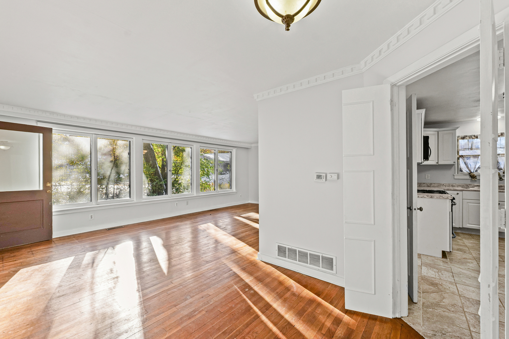 302 Flora Drive Champaign, IL 61821 - Photo 8 of 34 a view of an empty room and glass door