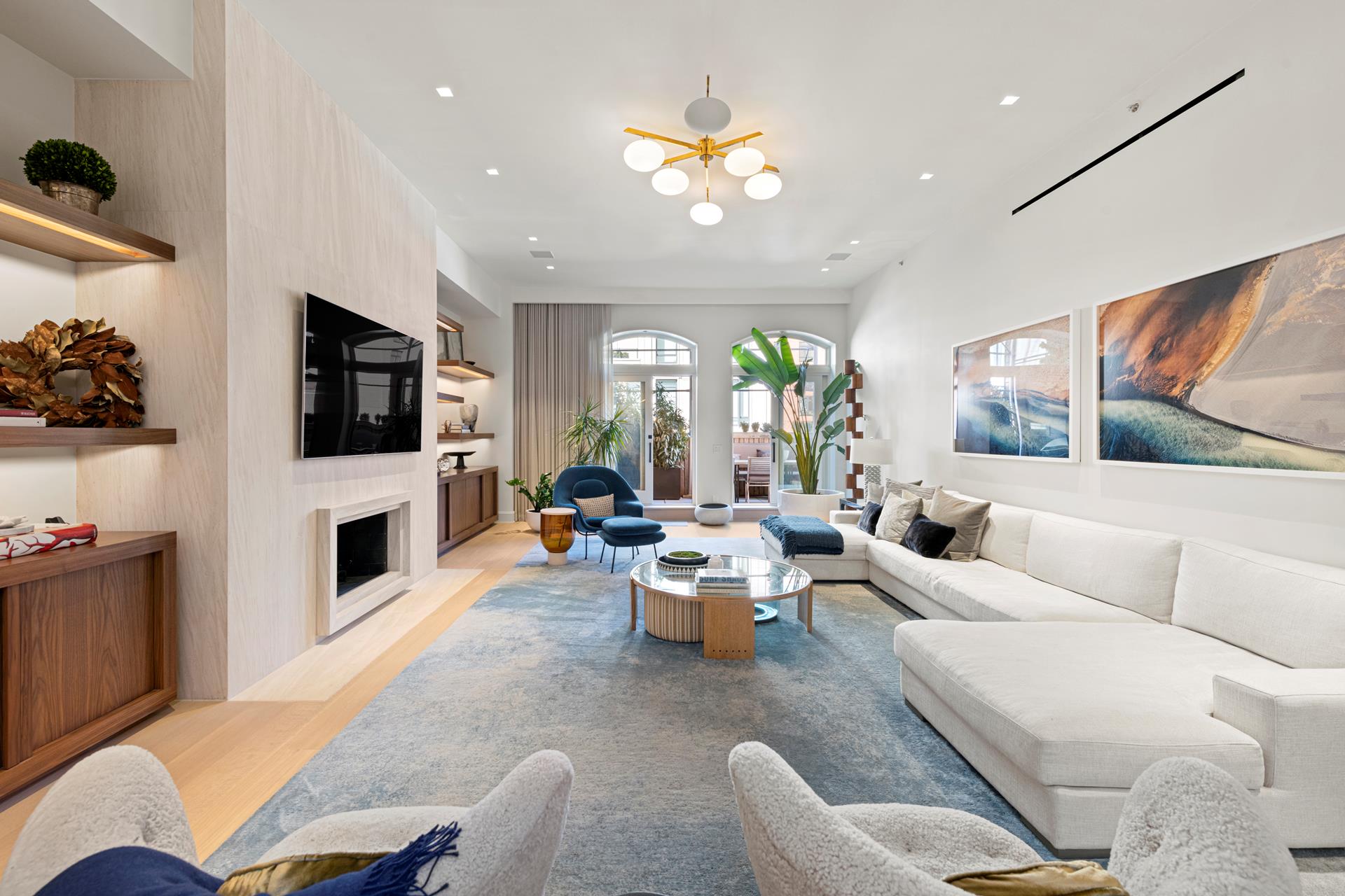a living room with fireplace furniture and a flat screen tv