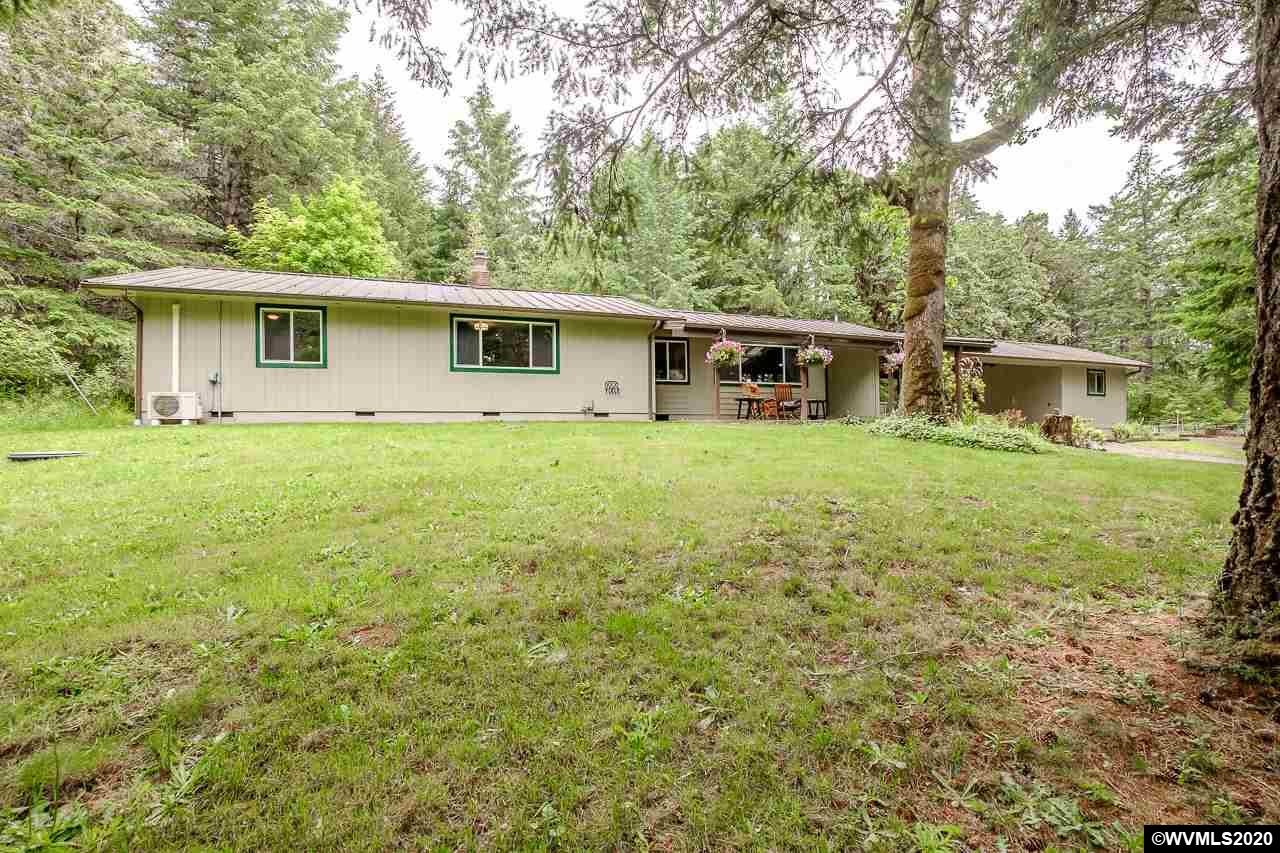 4890 Liberty Road Dallas, OR 97338 - Photo 1 of 42 a view of a house with a yard