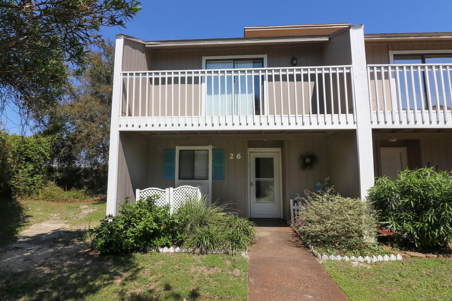 26 Court Destin, Unit 26 Destin, FL 32541 - Photo 1 of 14 front view of a house with a yard