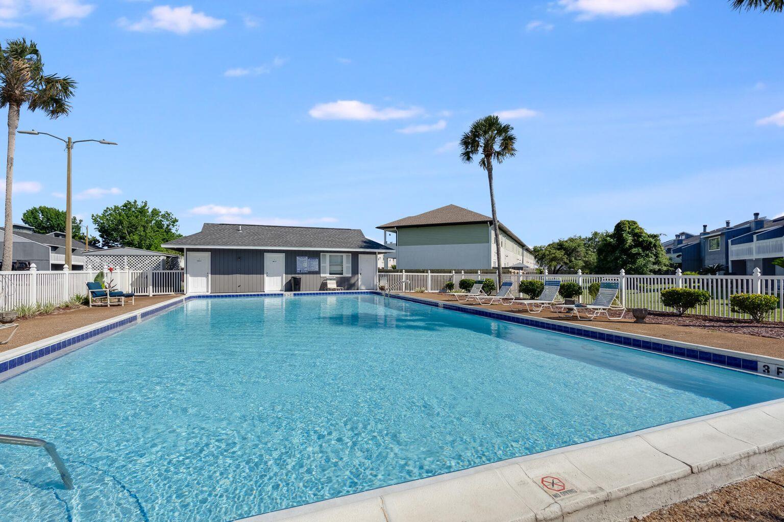 26 Court Destin, Unit 26 Destin, FL 32541 - Photo 2 of 14 a front view of house with yard and outdoor seating