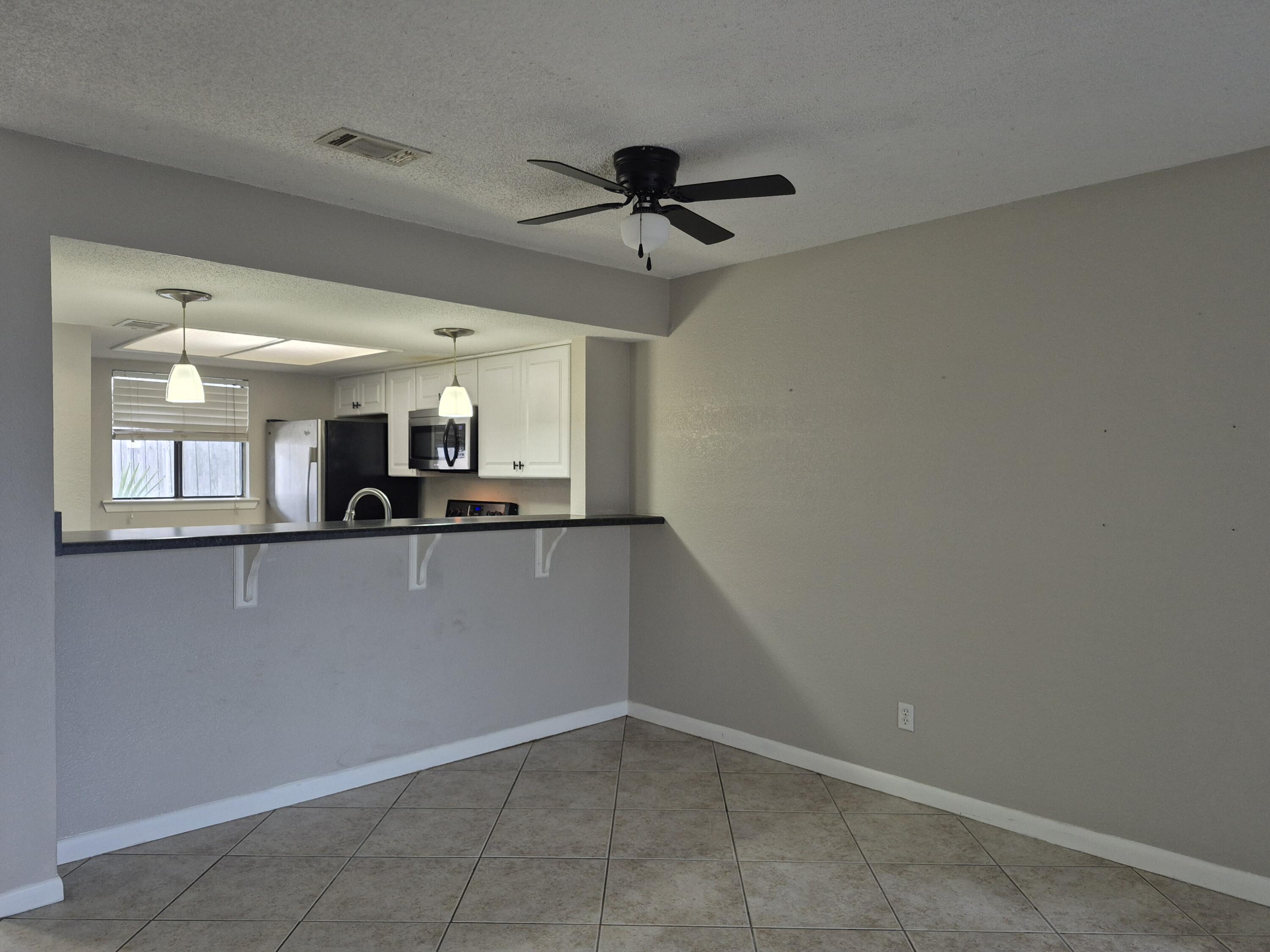 26 Court Destin, Unit 26 Destin, FL 32541 - Photo 4 of 14 a view of a kitchen with a sink and cabinet