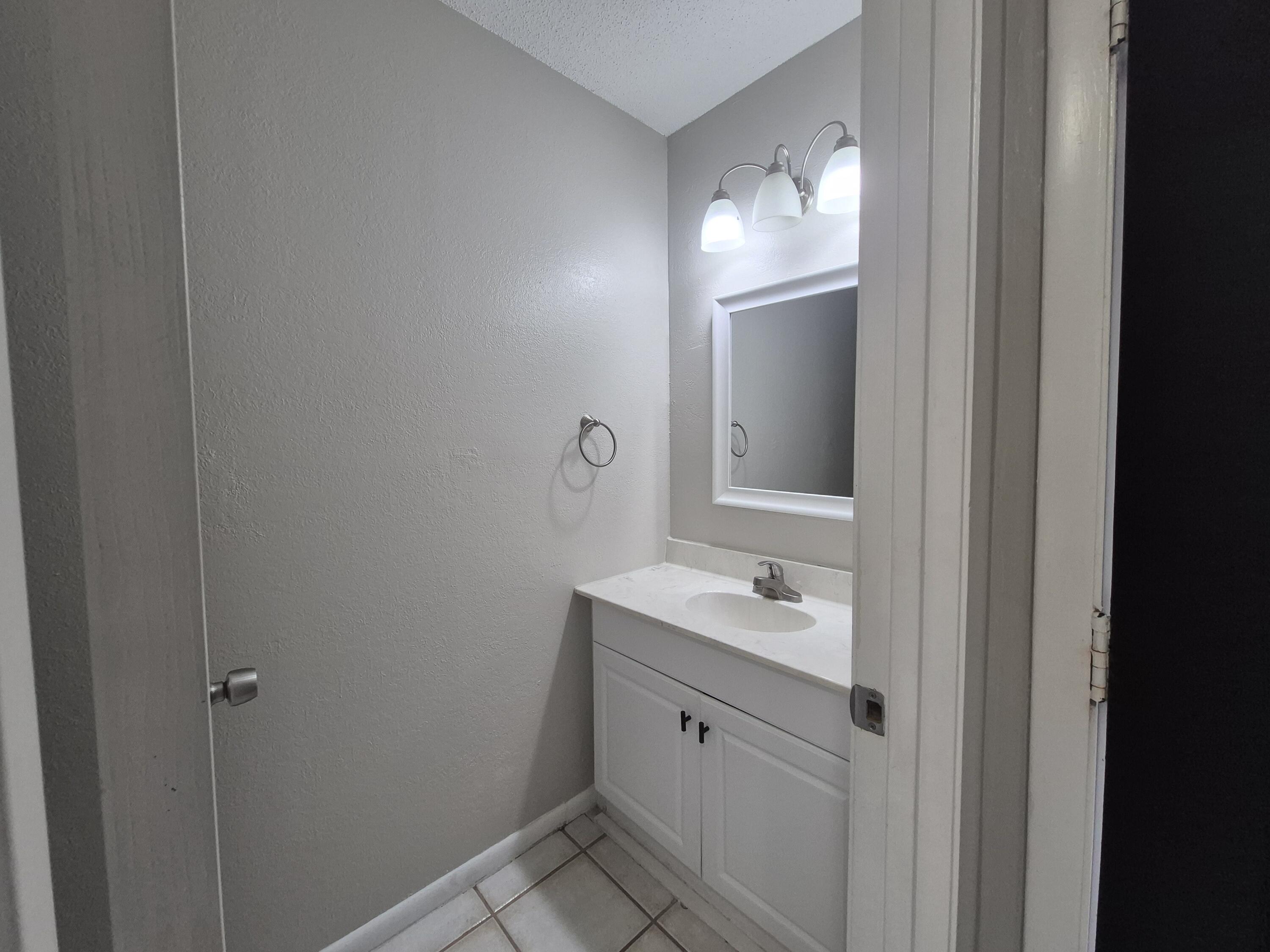 26 Court Destin, Unit 26 Destin, FL 32541 - Photo 6 of 14 a bathroom with a sink and a mirror