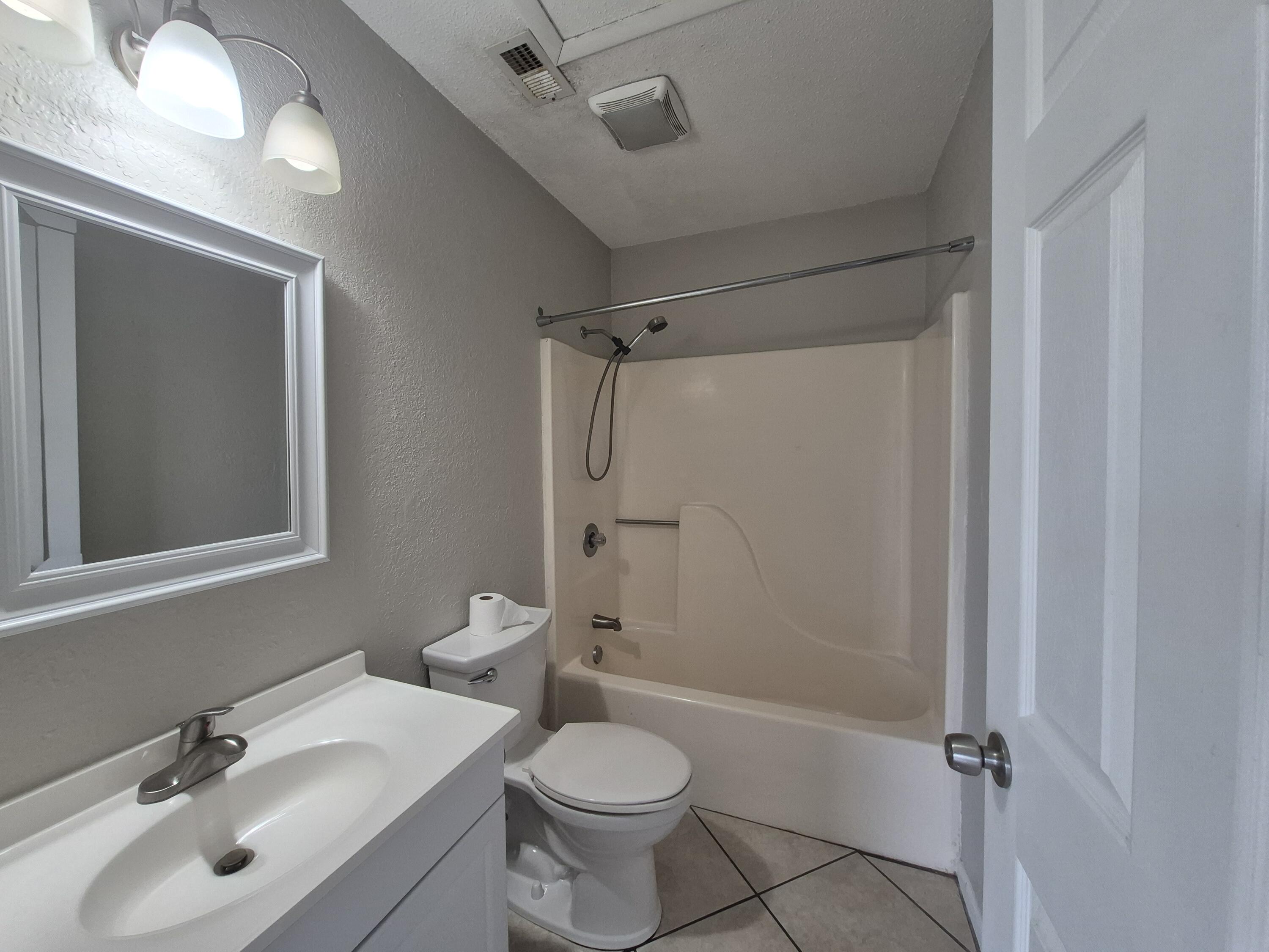 26 Court Destin, Unit 26 Destin, FL 32541 - Photo 9 of 14 a bathroom with a sink toilet and shower