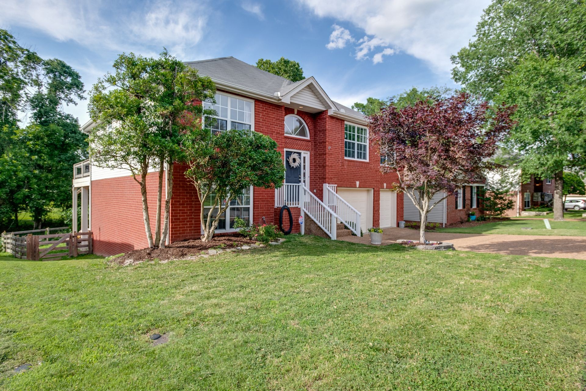 1065 Meandering Way Franklin, TN 37067 - Photo 2 of 33 a view of a house with a yard and sitting area