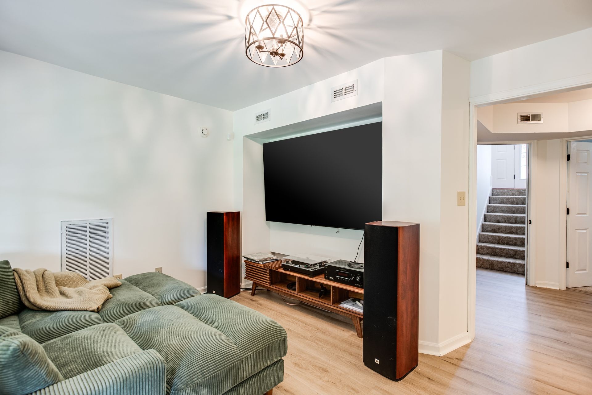 1065 Meandering Way Franklin, TN 37067 - Photo 23 of 33 a living room with furniture and a flat screen tv