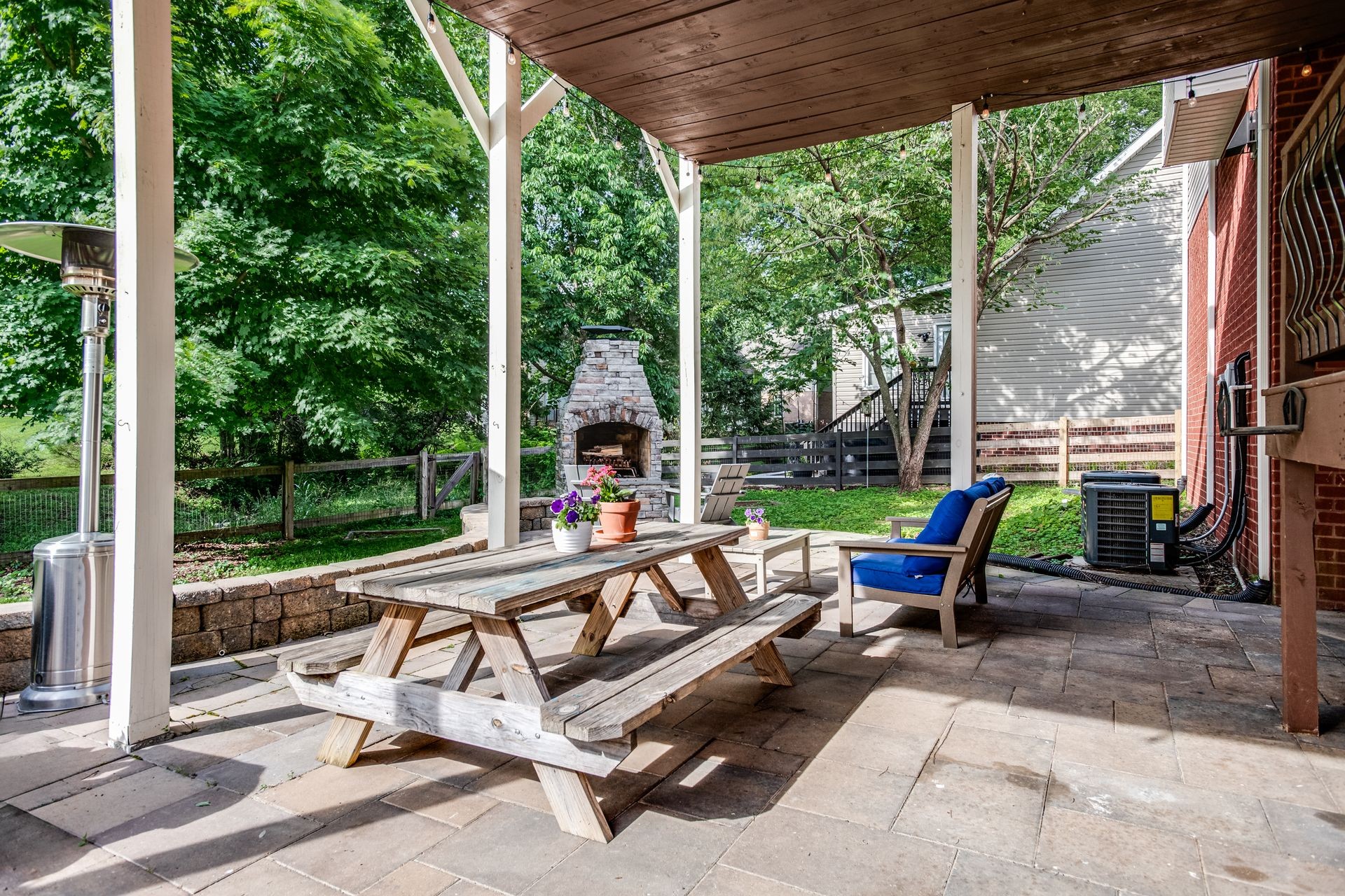1065 Meandering Way Franklin, TN 37067 - Photo 28 of 33 a view of a patio with a table chairs and a backyard