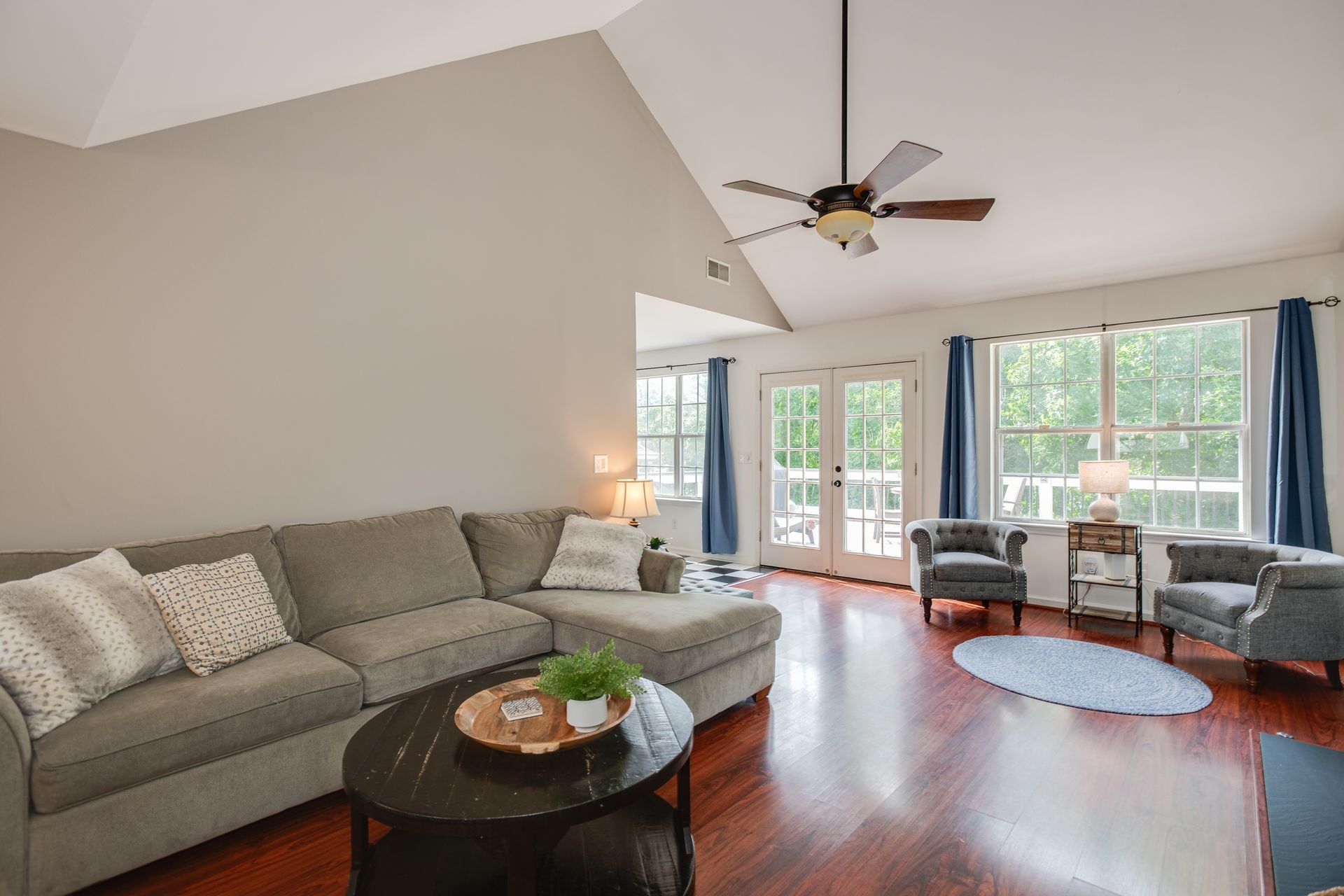 1065 Meandering Way Franklin, TN 37067 - Photo 5 of 33 a living room with furniture a ceiling fan and a window