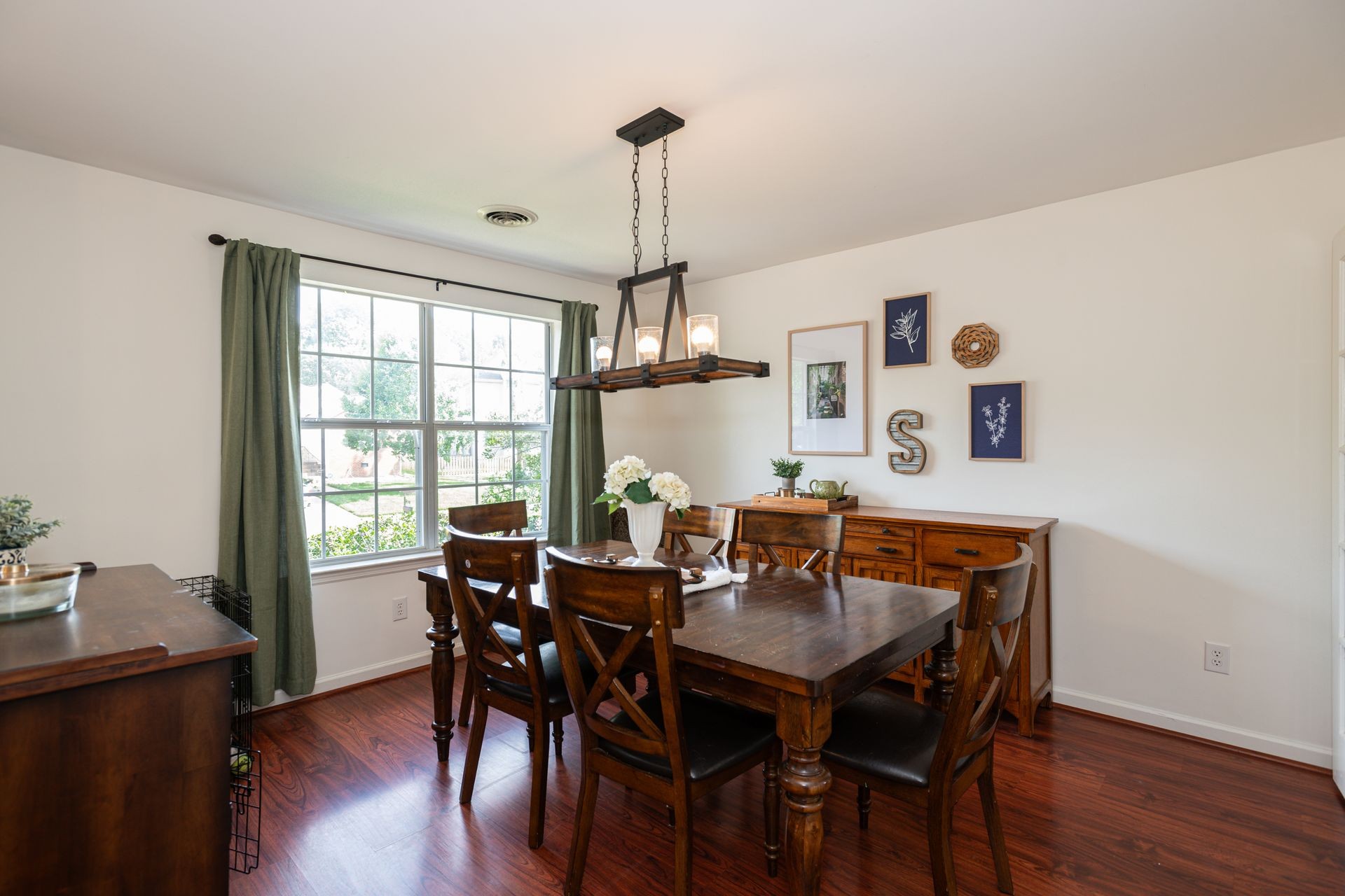 1065 Meandering Way Franklin, TN 37067 - Photo 6 of 33 a view of a dining room with furniture window and wooden floor