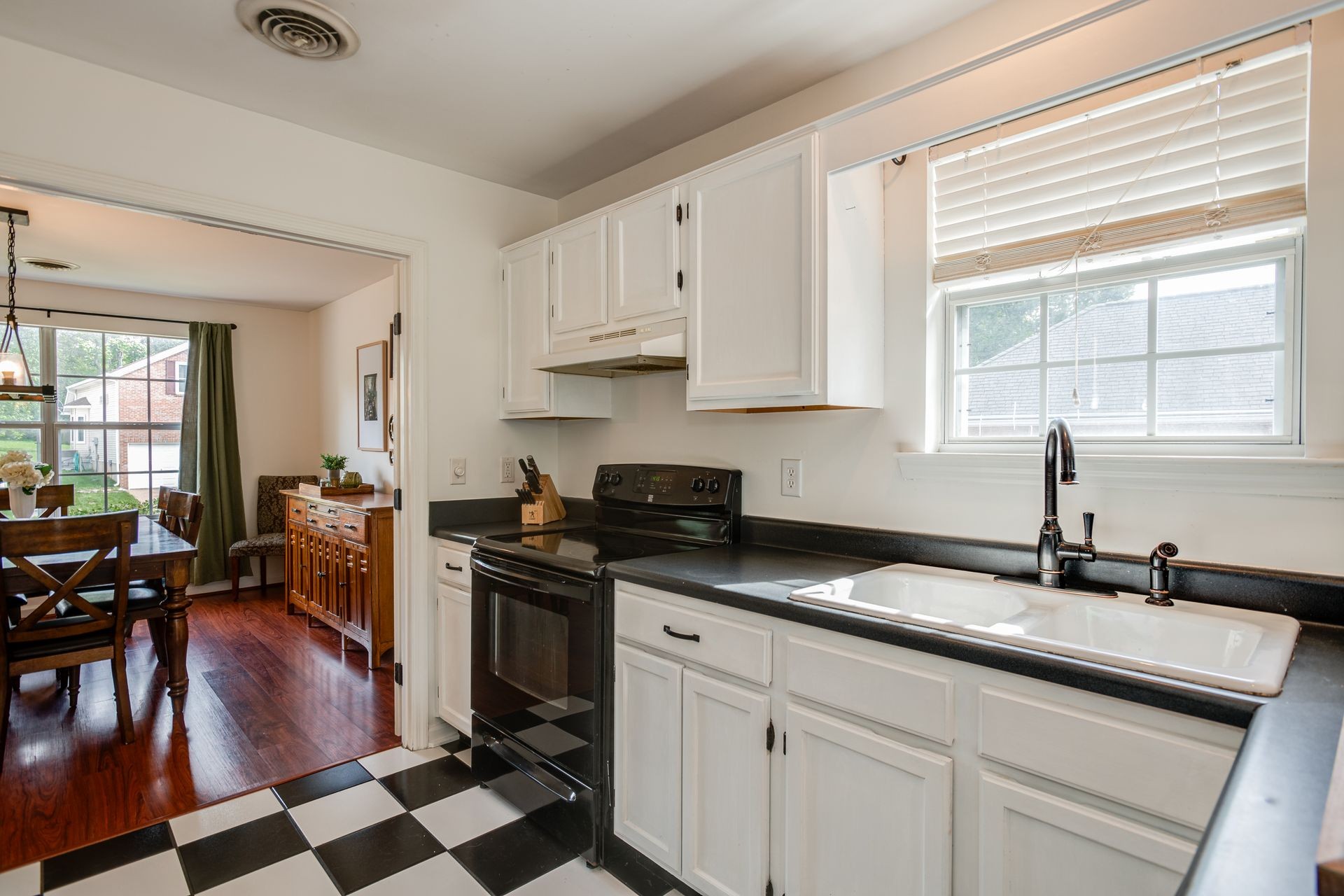 1065 Meandering Way Franklin, TN 37067 - Photo 9 of 33 a kitchen with stainless steel appliances granite countertop a sink stove and cabinets