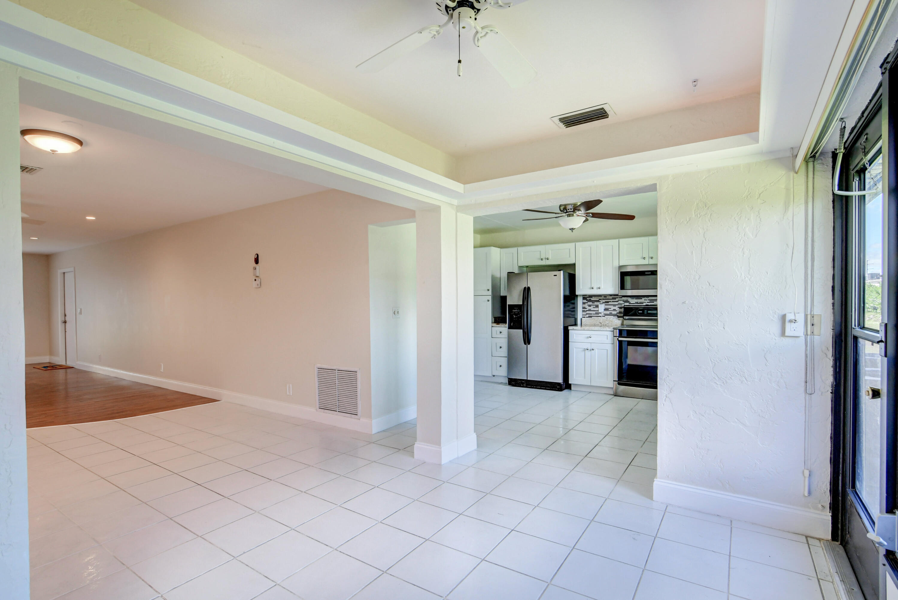 4867 Hawkwood Road, Unit B Boynton Beach, FL 33436 - Photo 11 of 37 a view of a refrigerator in kitchen and a sink
