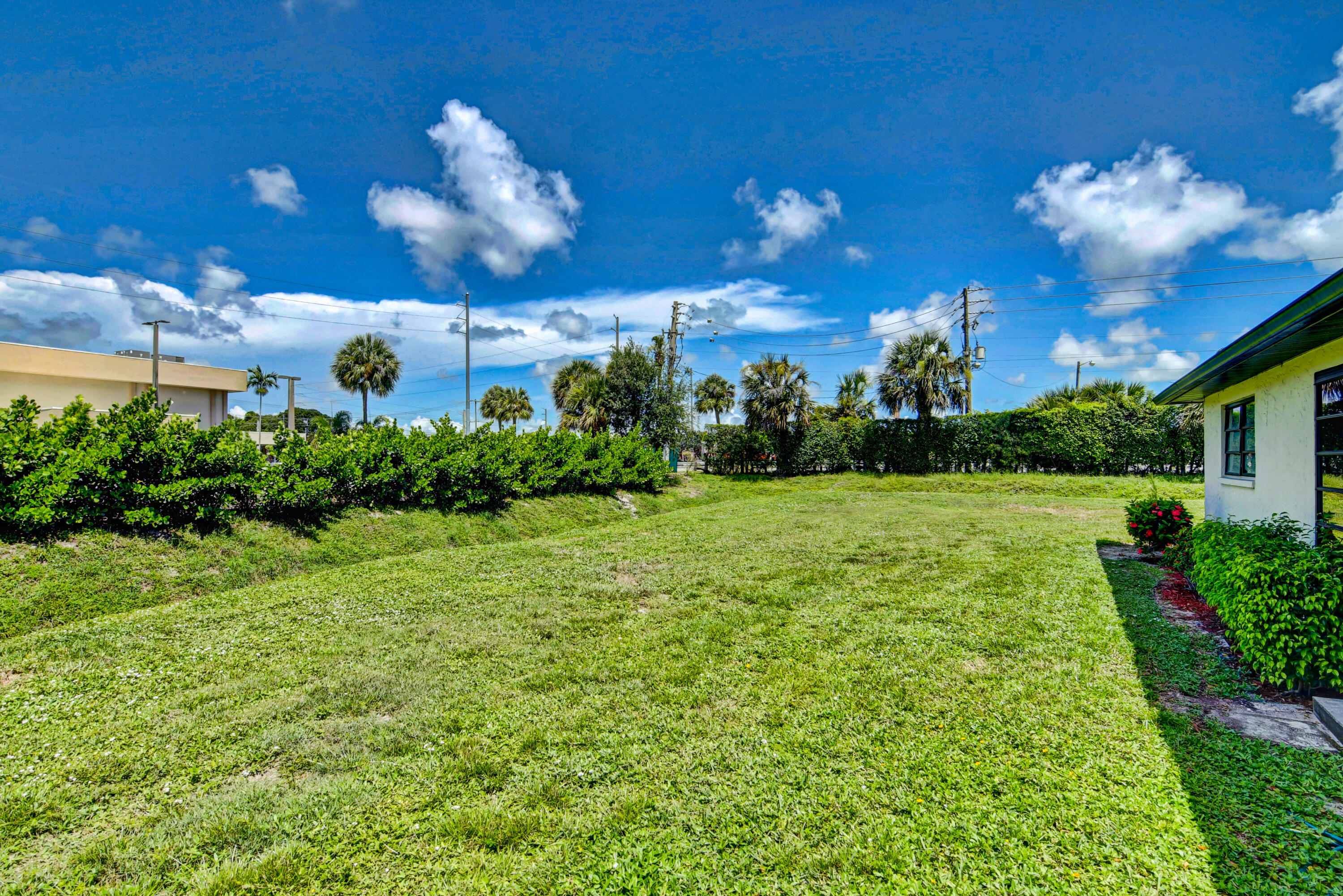 4867 Hawkwood Road, Unit B Boynton Beach, FL 33436 - Photo 36 of 37 a view of a house with a backyard