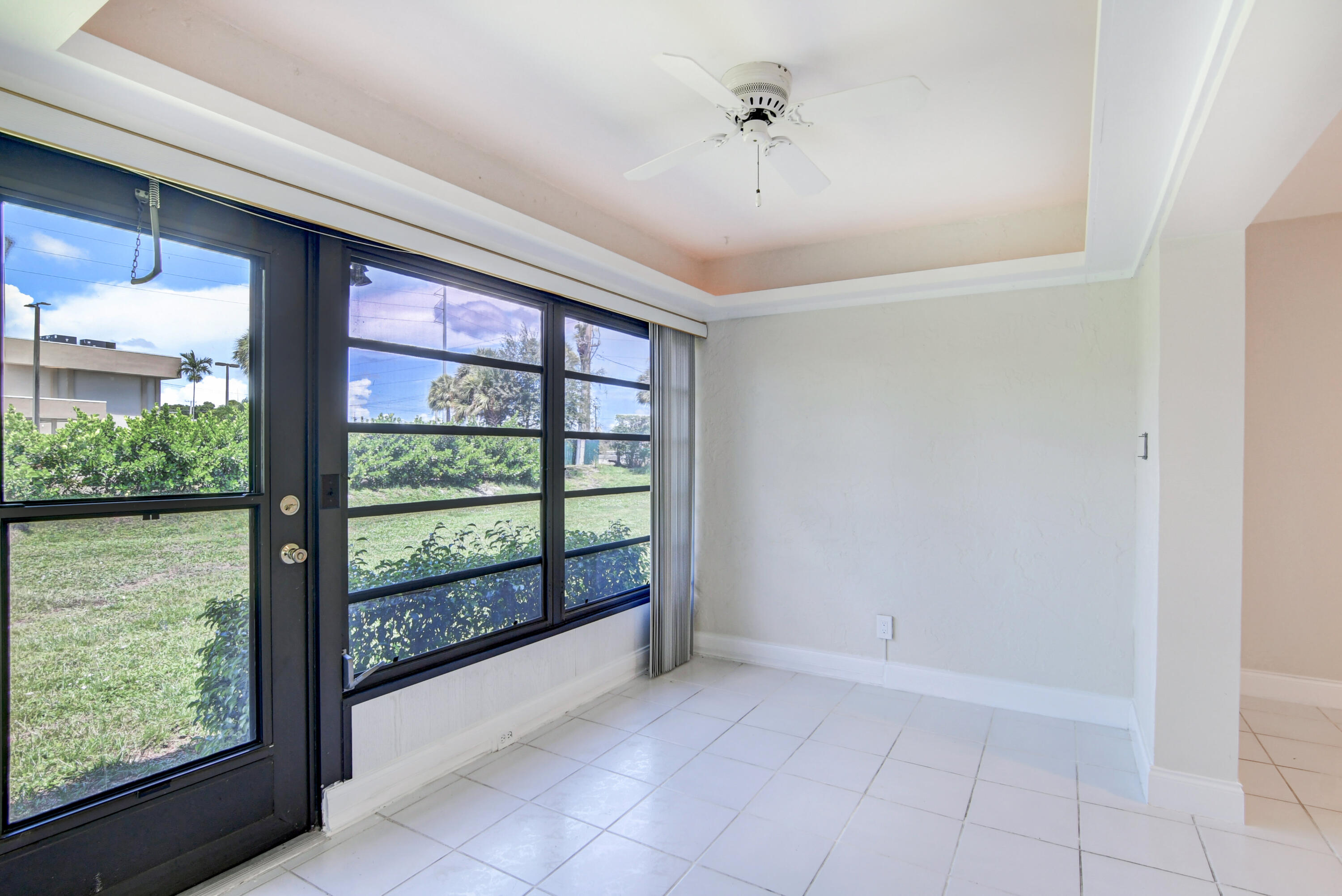 4867 Hawkwood Road, Unit B Boynton Beach, FL 33436 - Photo 9 of 37 a view of a room with a large window