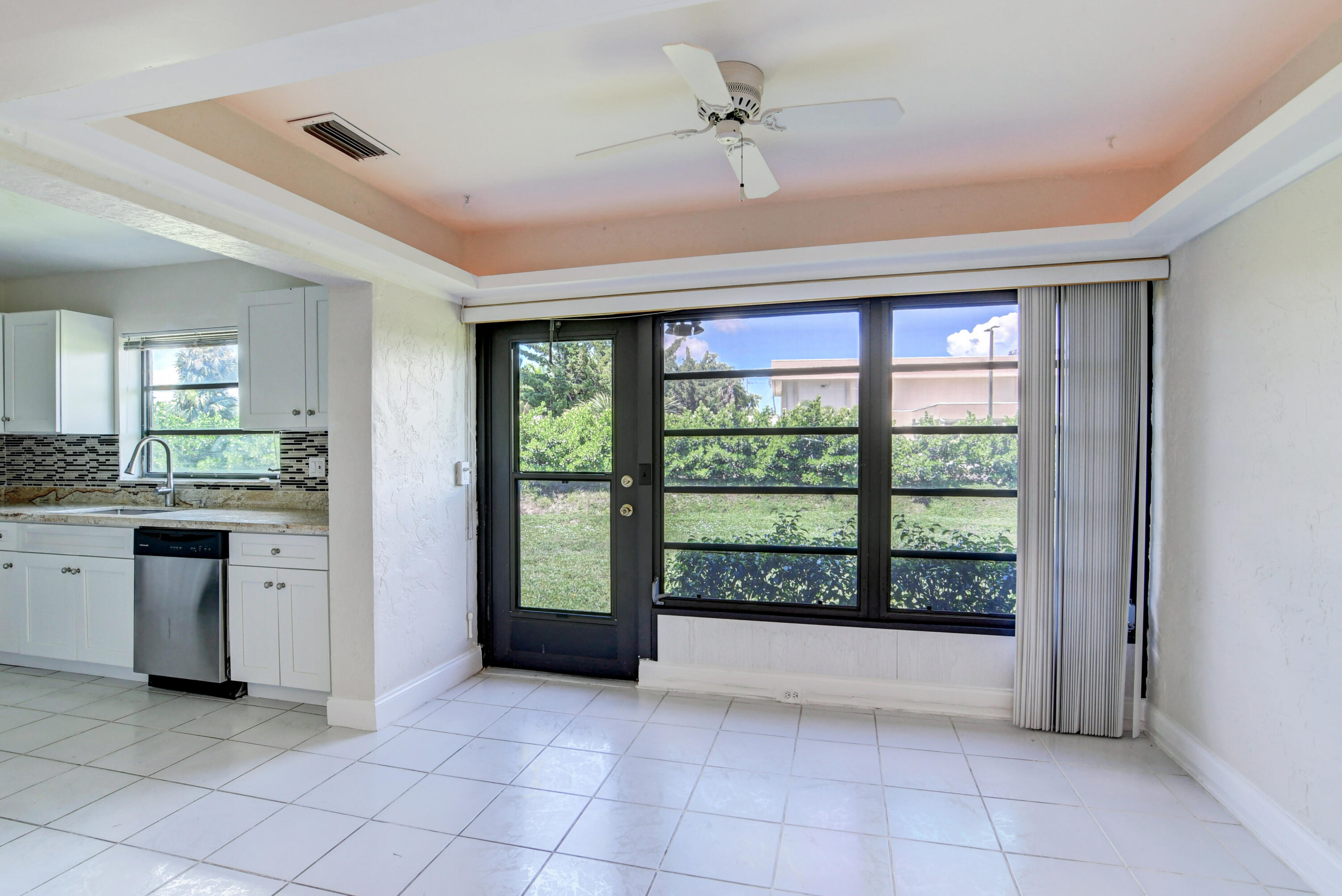 4867 Hawkwood Road, Unit B Boynton Beach, FL 33436 - Photo 10 of 37 a view of kitchen with stainless steel appliances granite countertop a refrigerator and a sink