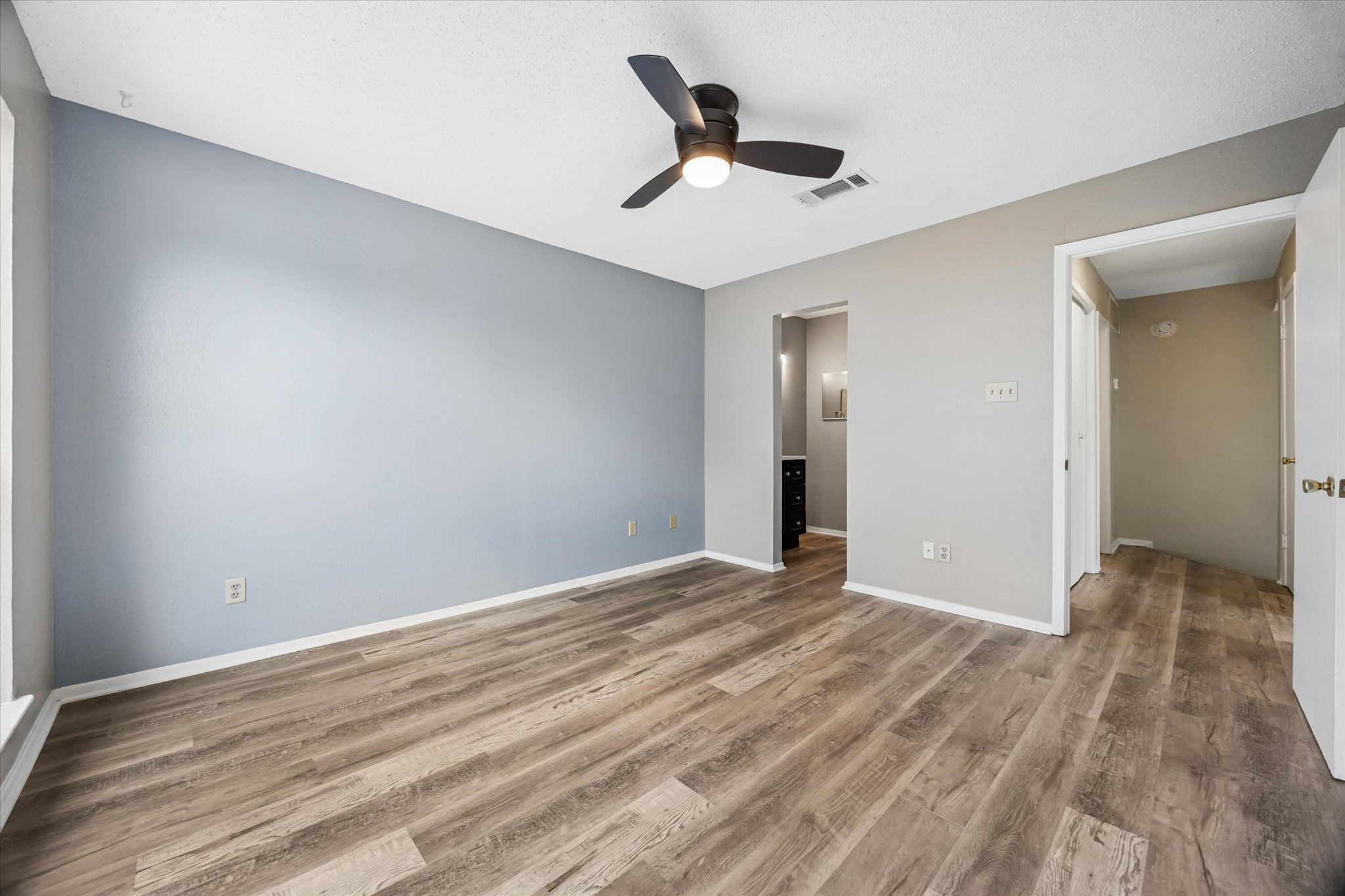 2018 West Rundberg Lane, Unit 13A Austin, TX 78758 - Photo 7 of 11 a view of empty room with wooden floor