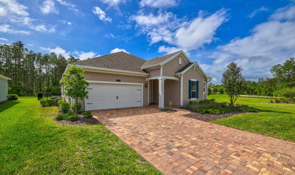 a view of a house with a yard