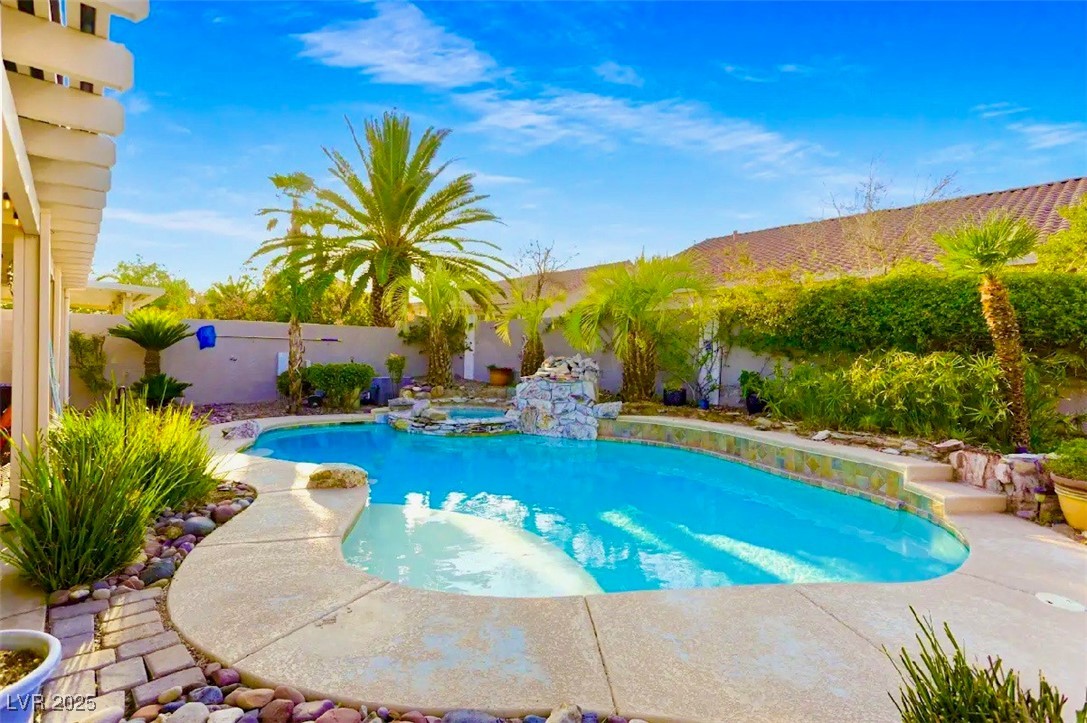 Dive into relaxation with this inviting pool and s