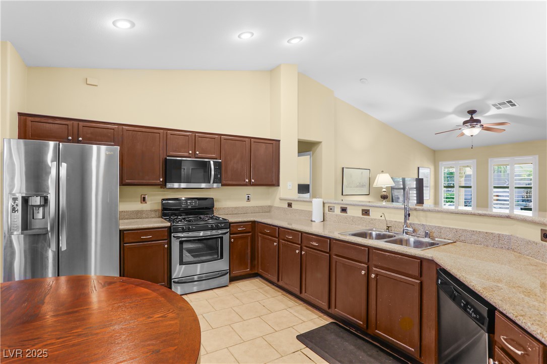8928 Rusty Rifle Avenue Las Vegas, NV 89143 - Photo 11 of 23 Modern kitchen featuring stainless steel appliance
