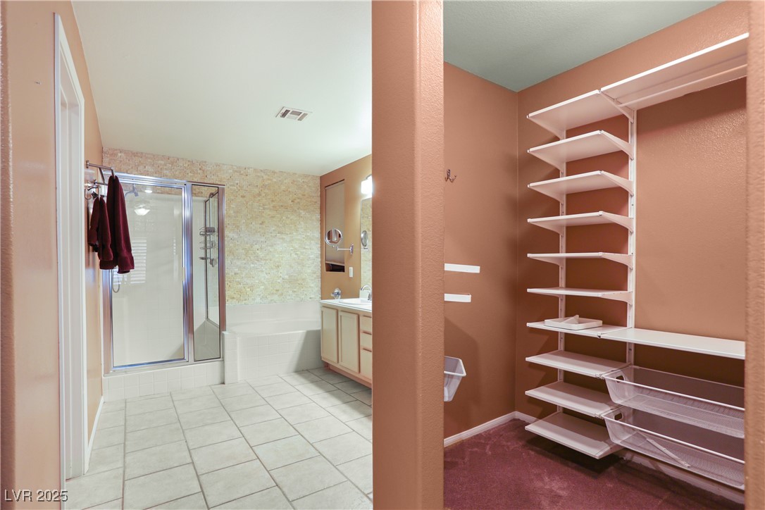 8928 Rusty Rifle Avenue Las Vegas, NV 89143 - Photo 17 of 23 One of two walk-in closets, equipped with shelves