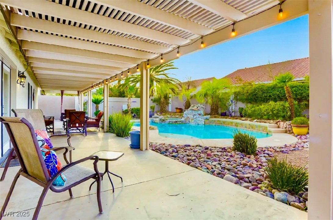 8928 Rusty Rifle Avenue Las Vegas, NV 89143 - Photo 2 of 23 Expansive full-length patio overlooks the sparklin
