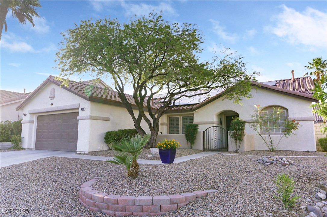 8928 Rusty Rifle Avenue Las Vegas, NV 89143 - Photo 4 of 23 Mediterranean-style home with Spanish accents, fea