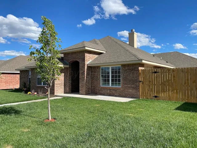 a house view with a garden space